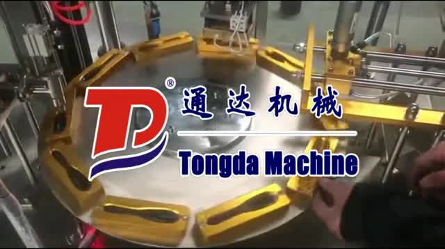 Rotary type honey spoon filling and sealing machine